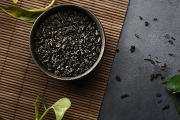 Asian food background - tea on the table. Dark background. Top view.