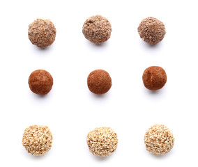 Tasty sweet truffles on white background