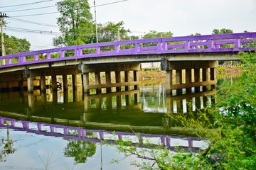 Purple bridge for traveling across the canal