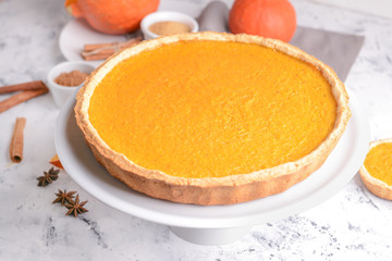 Tasty pumpkin pie on table