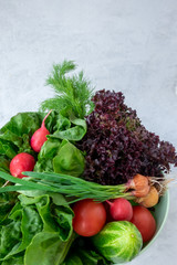Photo of a wire shopping basket full of fresh fruit and vegetables