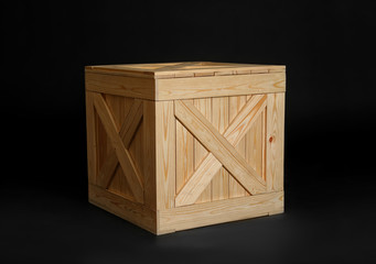 One closed wooden crate on black background