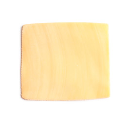 Slice of tasty cheese on white background, top view