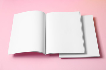 Empty book pages on pink background. Mockup for design