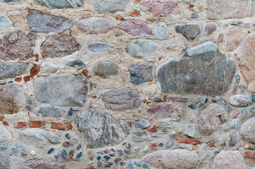 Texture of an old stone wall. Part of a stone wall for background.