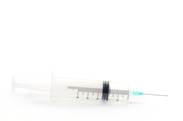 Medical syringe with a needle close-up. Syringe, medical injection isolated on white background. 