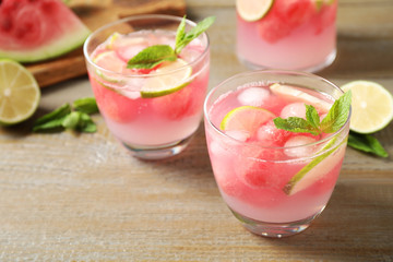 Tasty refreshing watermelon drink on wooden table