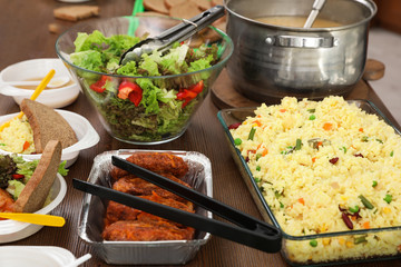 Table with food prepared to poor people in charity centre
