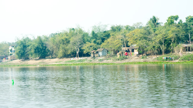 Ganges river shore (local name Damodar ) in sunset time with tropical lush of Gangetic plains in Purbasthali, West Bengal, India. A rural India landscape photography.
