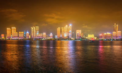 Fototapeta na wymiar At night, the Lighting Show is on the city skyline, Qingdao, China