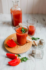Glass of tomato juice on on a light background Closeup Top view