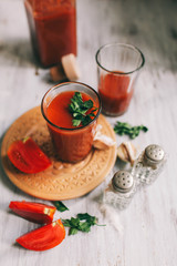 Glass of tomato juice on on a light background Closeup Top view