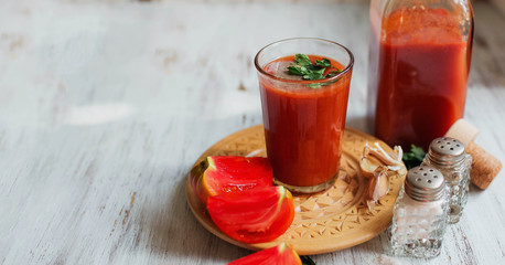 Glass of tomato juice on on a light background Closeup Top view