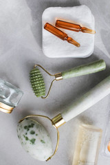 Dermaroller Natural stone, serum next to an anti aging face cream Beauty industry Close-up...