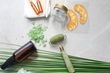 Dermaroller Natural stone, serum next to an anti aging face cream Beauty industry Close-up...