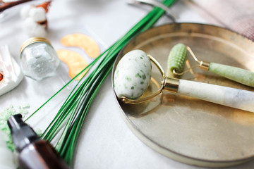Dermaroller Natural stone, serum next to an anti aging face cream Beauty industry Close-up...