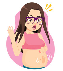 Surprised brunette pregnant woman with glasses first baby feet kicking belly