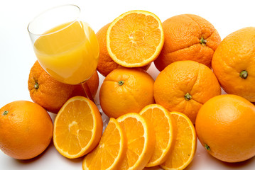 Juice glass and orange fruit isolated on white background