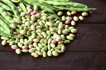 pods of beans and legumes grain closeup. background with raw beans.
