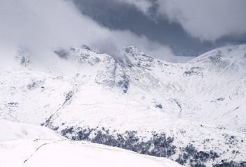 A close up of the snow covered summits of Fairfield and Hart Crag from the summit of Rampsgill Head.