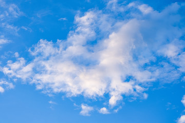 Naklejka na ściany i meble beauty high fluffy abstract clouds blue sky background fresh air in sunny day