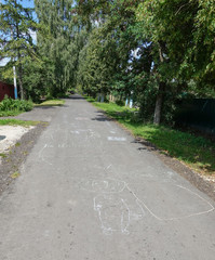 Children's drawing with chalk on asphalt