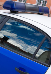 Obraz premium Police car with light bars on the street. Close-up view.