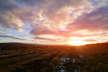 A dramatic red sky sunset over Bolt's Law in County Durham.