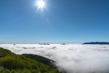 Panorama view from Unkai Terrace in summer time sunny day. Take the cable car at Tomamu Hoshino Resorts, going up to see the sea of clouds. Shimukappu village, Hokkaido, Japan