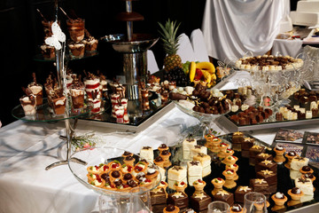 Colorful desserts and pastry served on a wedding party