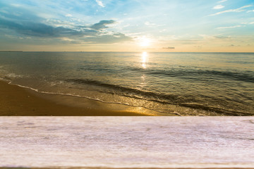 Wood table top on Tropical beach and sea. vintage filter