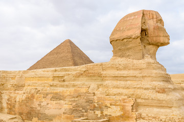 The great pyramid of Cheops and Sphinx in Giza plateau. Cairo, Egypt