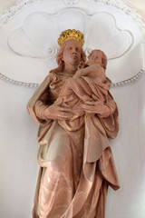 Virgin Mary with baby Jesus statue in Amorbach Benedictine abbey in Lower Franconia, Bavaria, Germany 