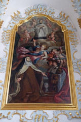 St. Mary Magdalene de Pazzi with St. Aloysius kneeling on a cloud, Saint Aloysius Gonzaga altar in Jesuit church of St. Francis Xavier in Lucerne, Switzerland