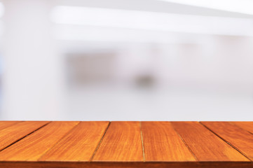 Wood table top on blur hall background