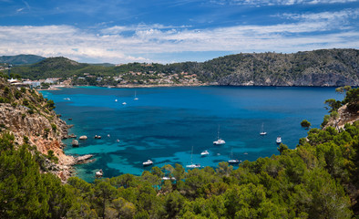 Bay with luxury yachts rocky mountains of Cala Blanca Andratx, Mallorca, Spain