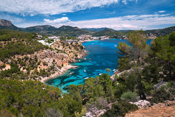 Panorama of bay with luxury yachts rocky mountains of Cala Blanca Andratx, Mallorca, Spain