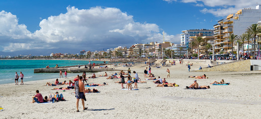 People sunbathing on the beach of El Arenal resort town,  Majorca, Baleares, Spain - obrazy, fototapety, plakaty