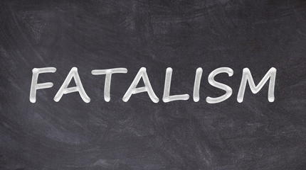 Obraz premium Fatalism text written on blackboard