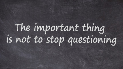 Fototapeta premium The important thing is not to stop questioning written on blackboard