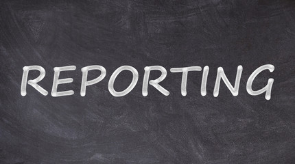 Obraz premium Reporting text written on blackboard