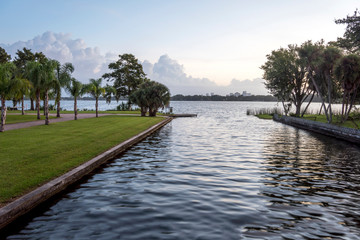 Water flows from the lake into a canal in the morning at Orlando, Florida