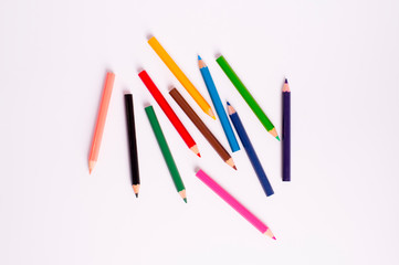 Top view color pencils on white background
