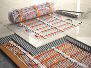 Underfloor heating installation concept. Mat elecric heating system with ceramic tiles and cement layers.