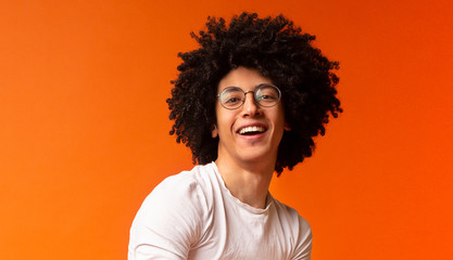 Portrait of awesome stylish african guy with bushy hairstyle