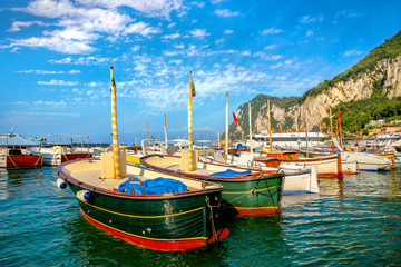 Touristic boats in bay Marina Grande. Capri island. Italy