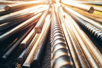 close up steel bar or steel reinforcement bar in the construction site with sunbeam at the morning,...