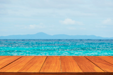 Wood table top on tropical ocean background