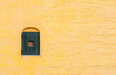 Yellow brick wall of an old house in Arhus, Denmark