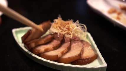 Eating Japanese grill pork belly shashu